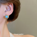 Gold Tone Round Blue Stone Stud Earrings with Textured Rims view 3