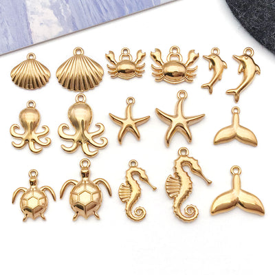 Yellow octopus and crab charms arranged on a light background