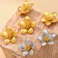 Textured Five Petal Flower Stud Earrings Gold Or Two Tone view 2
