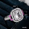 Square White Stone Ring with Pink Side Stones and Pavé Halo view 5