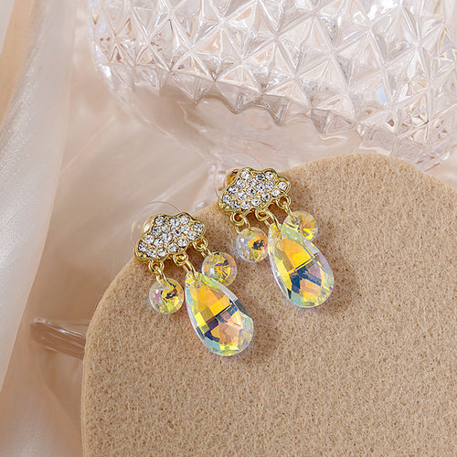 Gold cloud studs with iridescent crystal teardrop drops close-up