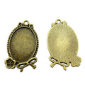 Oval Rose and Bow Cabochon Settings in Two Finishes view 4