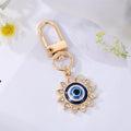 Gold Tone Crystal Heart and Sun Evil Eye Clip Keychains view 10