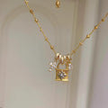 Silver Tone Padlock and Cross Pendant Chain Necklace view 1