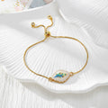 Gold Tone Peacock Feather Evil Eye Slider Bracelets in Nine Shapes view 12