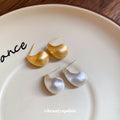 Brushed Gold Tone Curved Teardrop Stud Earrings With Decorative Metal Accents view 3