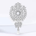 Crystal Rosette Bow Drop Brooch with Polished Metal and Decorative Accents view 2