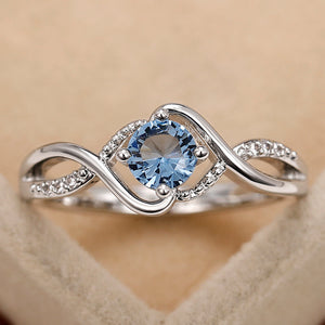 Blue Round Solitaire Wave Ring In Polished Silver Tone