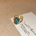 Gold Open Oval Turquoise Cabochon Twisted Band Ring view 6