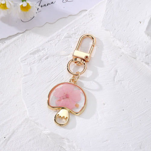 Pink pressed flower mushroom resin keychain with gold lobster clasp