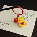 Yellow Heart-Holding Duck Keychain with Red Bell and Split Ring view 4