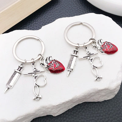 Main display of syringe stethoscope heartbeat and red heart keychains