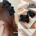 Black Satin Bow Hair Claw With Layered Loops And Knotted Center view 1