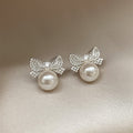 Silver Bow Pearl Stud Earrings with Crystal Accents view 3