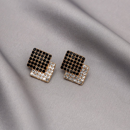 Black clear crystal double square gold studs on gray satin