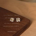 Gold Tone Clear Stone Mini Geometric Flower Stud Earrings view 1