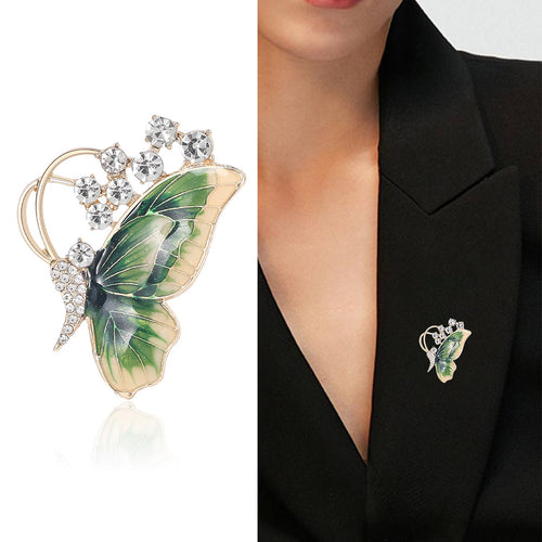 Gold green enamel butterfly brooch product and worn on blazer