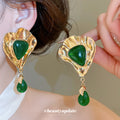 Green Geometric Drop Stud Earrings in Hammered Gold Tone view 3