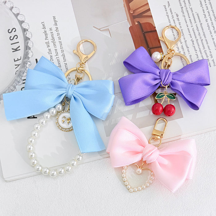 Satin Ribbon Bow Keychain with Pearl Heart Charm Accent