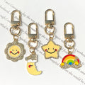 Gold Tone Rainbow Star Moon and Sun Clip Keychains view 1