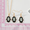 Gold Tone Black Enamel Hamsa Eye Necklace and Hook Earrings view 2