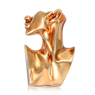 Front view of abstract sculptural profile of a woman with a flowing neck and folded collar