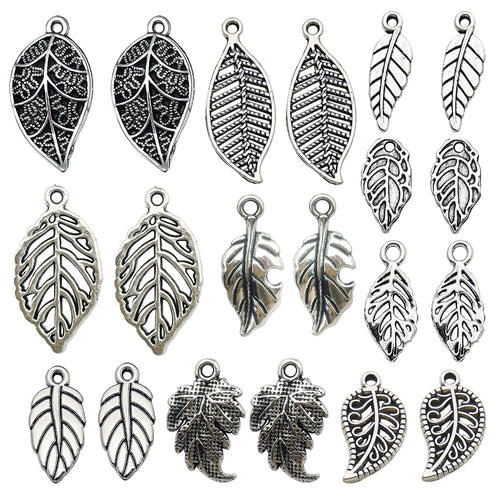 Antique silver leaf charms pictured with visible surface details