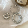 Silver Metallic Spiral Coil Hair Tie In The Listed Medium Style view 2