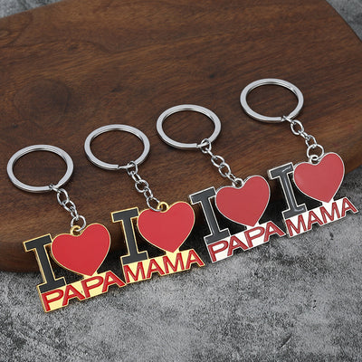 Four red heart keychains show Papa and Mama lettering with gold-tone and silver-tone outlines.