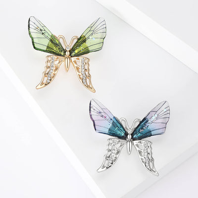 A butterfly with translucent upper wings and crystal lower wings shown on a white background.