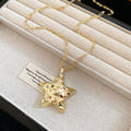 Fine Gold Tone Chain Necklace with Textured Star Pendant view 1