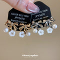 Bow Flower and Pearl Drop Ear Clips in Gold and Silver view 2