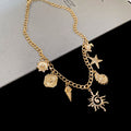 Gold Curb Chain Ocean Charm Necklace Sun Star Turtle Shell view 1