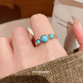 Gold Open Ring Oval Blue Stone Twisted Rope Border view 3