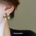 Gold Tone Brown Cabochon Floral Stud Earrings With Decorative Metal Accents view 3
