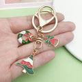 Christmas Charm Keychains Featuring Green Butterfly Across 81 Pictured Variations view 2