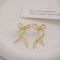 Hammered Ribbon Bow Gold and Silver Long Stud Earrings view 4