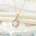 Gold Tone Crystal Teardrop Evil Eye Necklace and Earring Options view 8