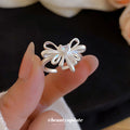 Silver Open Bow Ring With Heart Clear Crystal Center view 2