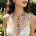 Round Bead Necklaces With Three Gold And Cream Strawberry Pendants view 1