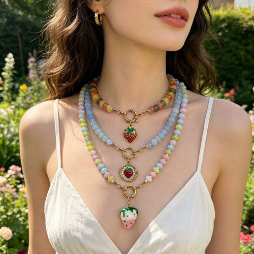 Front display of the pictured strawberry pendant necklaces and its visible color details