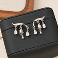 Silver Tone Lily Bell and Clear Stone Dangle Stud Earrings view 2