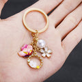 Pink Butterfly White Flower and Pearl-Look Wreath Keychain view 3