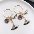 Black and White Crown Hat and Heel Metal Keychain Pair view 2