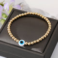 Gold Tone Beaded White Blue Evil Eye Stretch Bracelet view 4