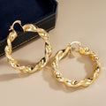 Gold Tone Twisted Open Hoop Earrings With Sculpted Texture view 2
