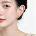 Gold Tone Clear Stone Pave Sculpted Ribbon Bow Stud Earrings view 2