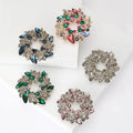 Colorful Crystal Wreath Brooch With Polished Metal And Sculpted Decorative Details view 1