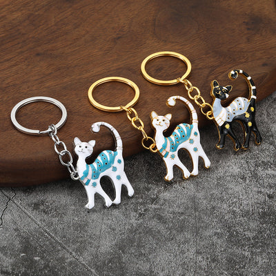 Three patterned cat keychains displayed with gold-tone and silver-tone split rings.