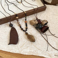 Brown Beaded Cord Necklaces with Botanical Pendants view 2